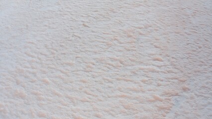 Aerial view of a dried pink salt lake on a beautiful summer evening.