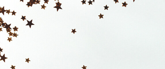 Banner with golden stars confetti scattered on a blue background.