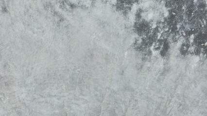 Gray concrete sidewalk with stains and uneven color. Roadside walkway. Texture and background image.