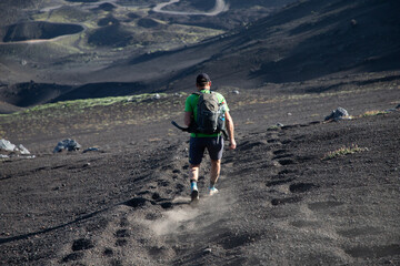 hiker trekking on mount Etna