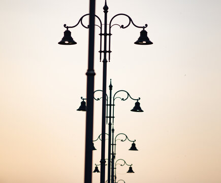 row of street lapms at sunset