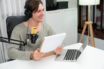 Host channel in smart broadcaster with talking show on live social media streaming with script note...