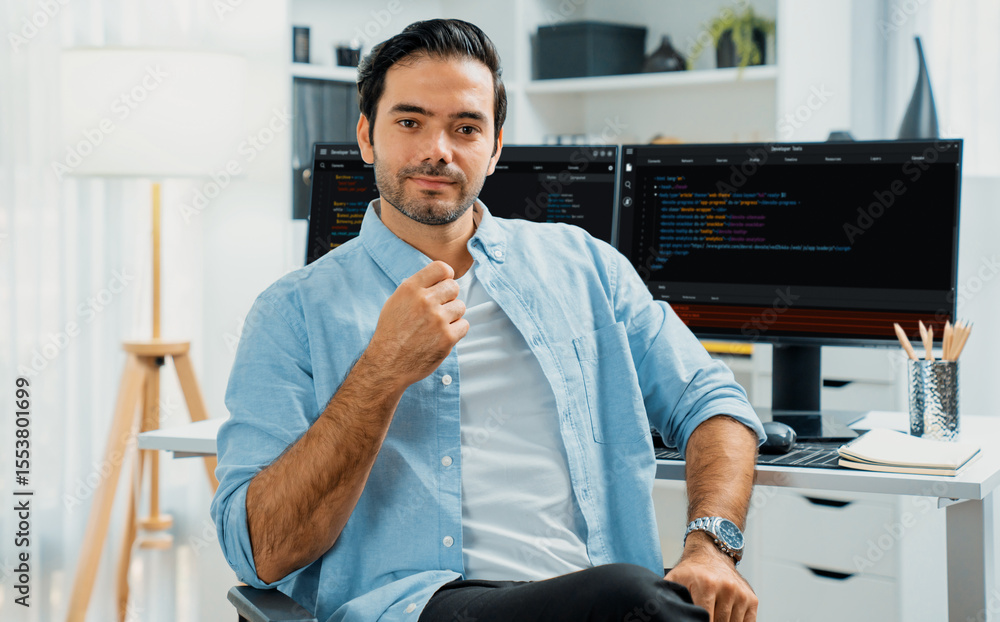 Poster profile's smart it developer looking camera to pose against on software development coding on two pc
