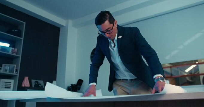 male automotive engineer working on car design in office