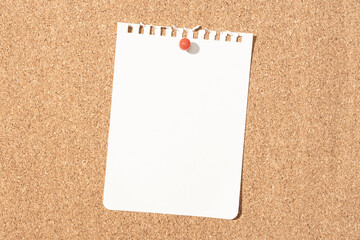 Blank notebook paper sheet pinned on cork board. Template Mock up
