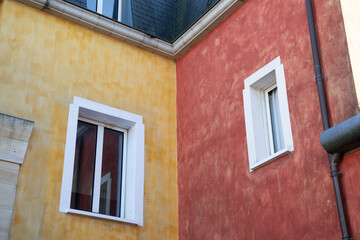 facade colorful red yellow wall corner of an old house