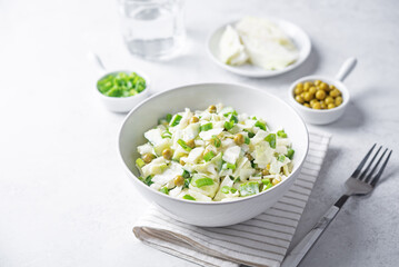 Cabbage cucumber green peas mayonnaise salad in a bowl
