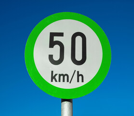 Green advisory speed limit sign