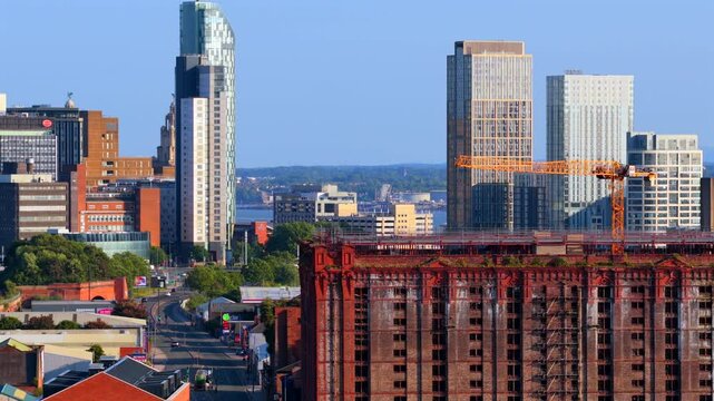 Liverpool city skyline from the Vauxhall area featuring an old Tabacco warehouse and modern skyscrapers. 