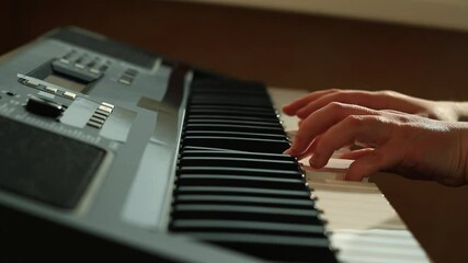 Slow motion capturin woman playoing piano pressing piano keys, showing precise moment of key depression. Artistic portrayal of musical performance details. - Powered by Adobe