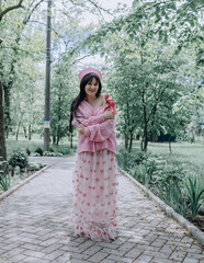 Pink summer mood of a girl with sincere emotions