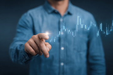 Businessman in Blue Shirt Pointing at Virtual Digital Stock Chart – Modern Technology Interface