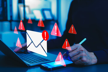 Email security threat notification and spam warning concept. A person using smartphone with icons of mail envelopes showing red warning symbols represent potential email security threats, spam alerts,