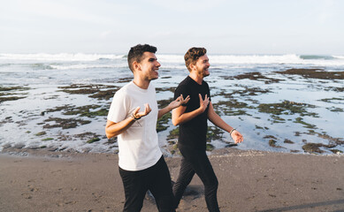 Two professionals connect in barefoot dialogue by waves, embodying digital‑analog equilibrium,...