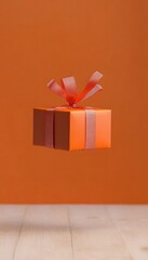 Floating orange gift box with ribbon