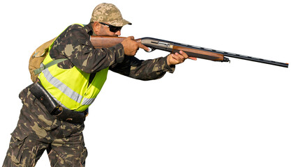 Hunter man in camouflage with a gun during the hunt in search of wild birds or game. Autumn hunting...