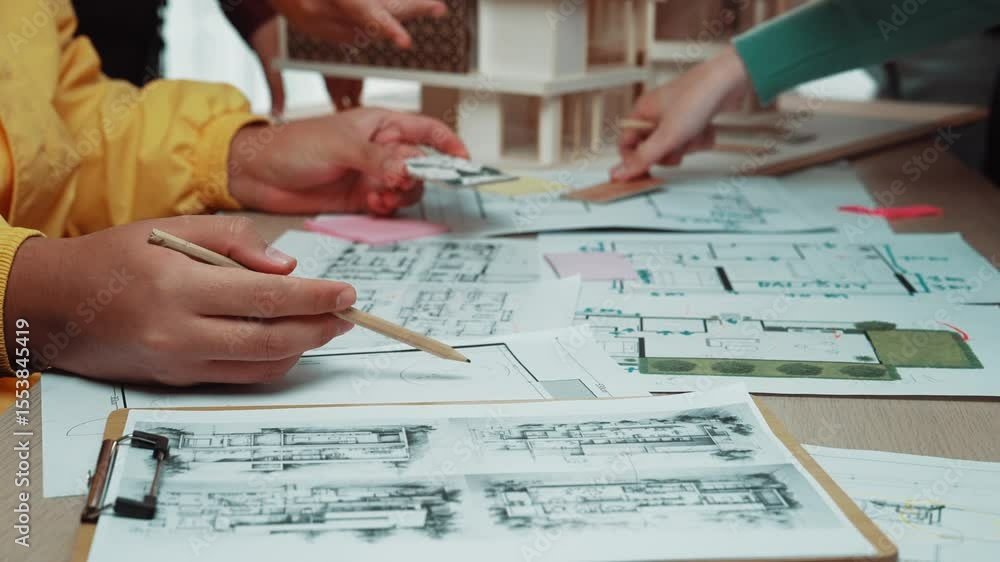 Poster a vibrant scene capturing young architects engaged in a collaborative design workshop, focusing on b