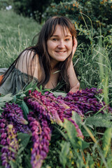 In combination with nature and flowers, harmony with oneself, happy moments, peace and balance. A charming girl in nature.