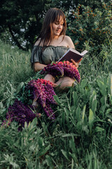 In combination with nature and flowers, harmony with oneself, happy moments, peace and balance. A charming girl in nature.