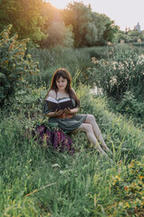 In combination with nature and flowers, harmony with oneself, happy moments, peace and balance. A charming girl in nature.