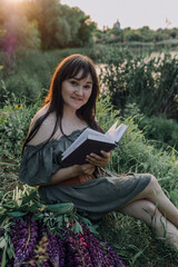 In combination with nature and flowers, harmony with oneself, happy moments, peace and balance. A charming girl in nature.