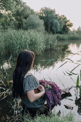 In combination with nature and flowers, harmony with oneself, happy moments, peace and balance. A charming girl in nature.