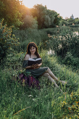 In combination with nature and flowers, harmony with oneself, happy moments, peace and balance. A charming girl in nature.