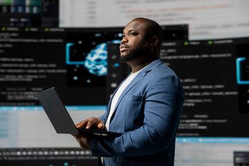 African american coder expert immersing in software development for a high tech work environment,...