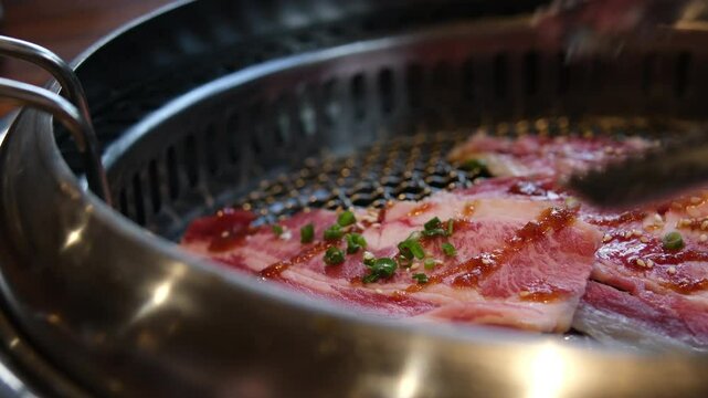 Electric grill, cooking pork. Grilled meat, homemade barbecue. Let's fry a juicy steak. Tasty and appetizing pork. We prepare meat steaks at home