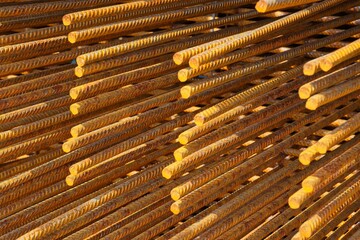 Close up of ribbed steel bars, showcasing their texture and arrangement, creating an industrial...