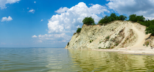 Mount Pyvykha rises along the shore of the Kremenchuk Reservoir in Ukraine, resembling a massive...