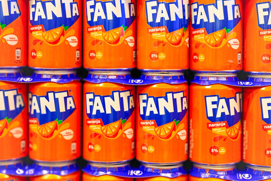 Alicante, Spain - May 22, 2025: Cans of Fanta orange drink display in grocery store