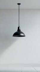 Obraz premium Modern Black Pendant Lamp Hanging in a Minimalist Interior With White Walls