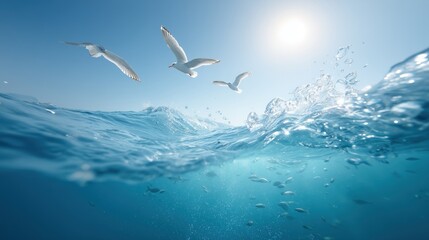 Obraz premium A serene view of the ocean with seagulls flying above the sparkling water under a bright sun.