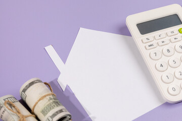 Budgeting for Homeownership – Paper House with Cash and Calculator