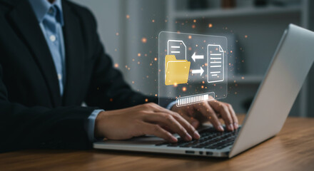 Data transfer and business operation: A professional in a sleek suit meticulously types on a laptop, while digital document icons visualize seamless data transfer in the background.