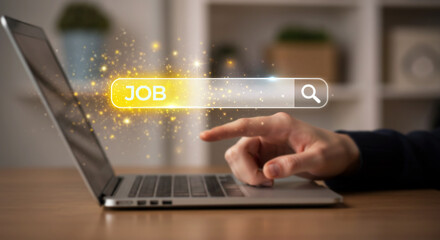 Finding a Job Online: A person's hand interacts with a laptop interface, their finger poised to search for job opportunities using an online search bar.