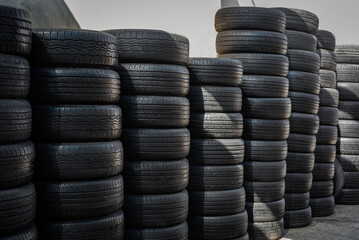 Stacks of Used Car Tires in Outdoor Storage Yard