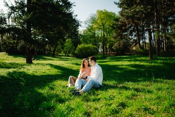Joyful couple enjoying a sunny day in a peaceful green park setting