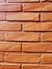 Red brick wall background, orange painted
