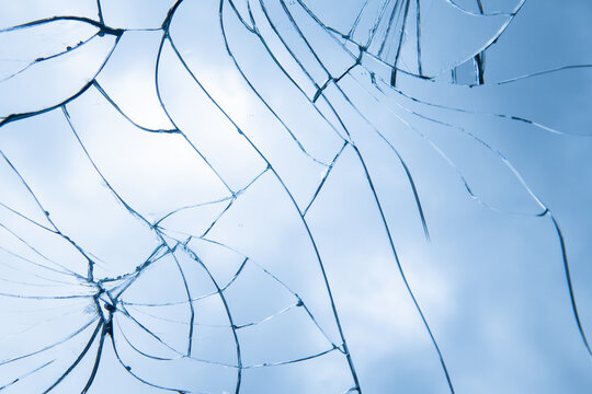 broken glass mirror background with cracks and pieces