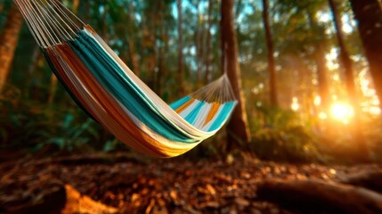 A beautifully arranged hammock with vibrant colors gently swaying in a lush forest, sunlight filtering through trees, evoking a sense of tranquility and relaxation in nature.