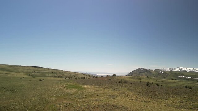Aerial of snow capped mountains in Steens Mountains in Eastern Oregon in spring