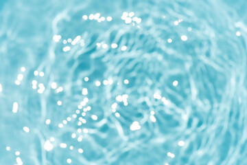 Blue water with ripples on the surface. Defocus blurred transparent blue colored clear calm water...