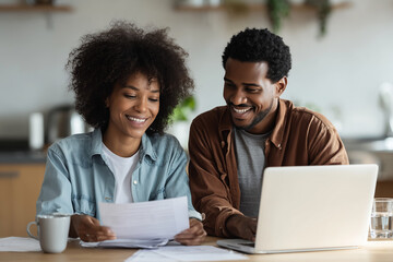 Couple reviews finances happy couple manages joint household finances