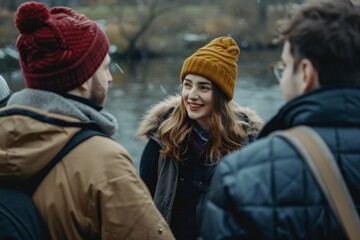 Group of friends walking in the park on a rainy winter day.