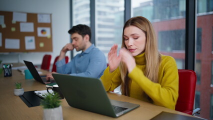 Tensed workers looking laptops screen solving hard business issues closeup.