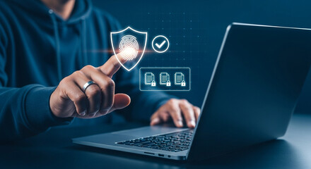 Photo of a man uses a laptop and touches a digital fingerprint shield icon
