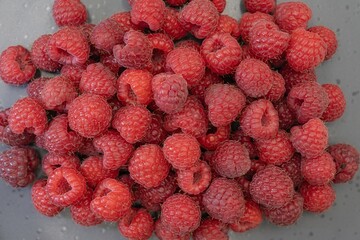 Fresh Organic Raspberries Close-Up. Natural Red Berries Background.