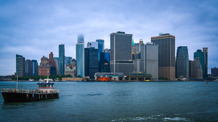 New York City skyline and Lower Manhattan Financial District buildings as seen from Governors Island over the New York Harbor, USA